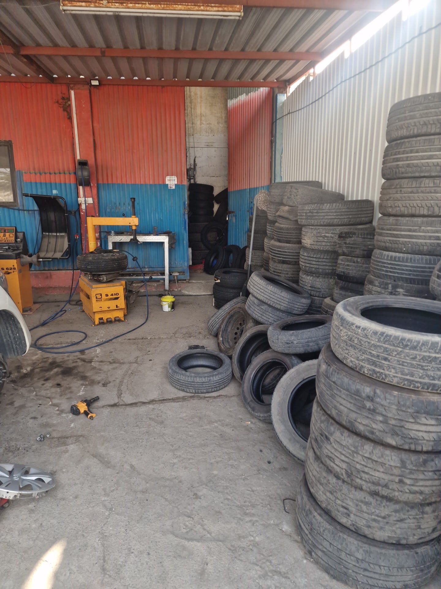 Inside the workshop — tyres ready to fit